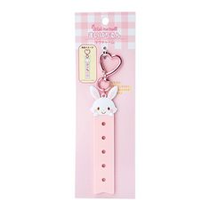 a pink strap with a bunny on the front and a heart shaped keychain attached to it