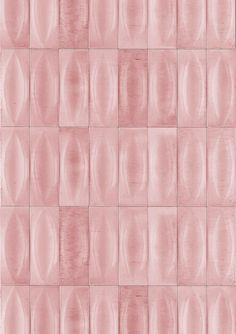 a pink tiled wall with circles on it