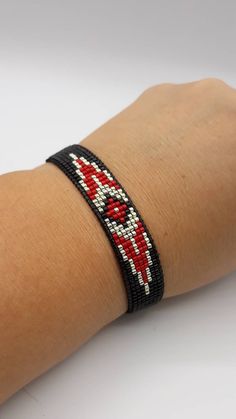 Black Wristband With Colorful Beads Gift, Red Bohemian Bracelet With Black Beads, Red Beaded Bracelets With Black Beads For Festival, Black Beaded Bracelet With Round Beads, Black Beaded Bracelets For Gift, Gift Black Beaded Bracelets, Handmade Black Bangle Friendship Bracelets, Black Handmade Friendship Bracelet, Red Wristband Bracelet With Colorful Beads