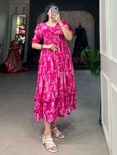 Step into elegance and grace with our exquisite collection of pink georgette frock dresses, adorned with delicate floral prints. These dresses, fully stitched and available in sizes XS to L, offer a perfect blend of comfort and style. Crafted from high-quality georgette fabric, each dress drapes beautifully, creating a flowy and feminine silhouette that enhances your natural charm. Whether you're attending a festival or a special event, these pink frock dresses are designed to make you stand out Floral Georgette Frocks, Pink Frocks For Women, Georgette Frock Designs, Floral Frocks For Women, Georgette Frock For Women, Georgette Dress Western, Frock Models For Women, Georgette Frocks, Floral Georgette Dress