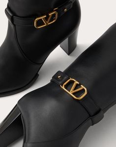 Valentino Garavani calfskin boot with VLogo Signature decoration - Strap with personalised VLogo Signature buckle in an antique-effect brass finish - Internal side zip - Leather-covered block heel - Heel height: 75 mm / 3 in. - Shaft height: 38 cm / 15 in. in an Italian size 37 - Made in Italy Formal Gold Calf Leather Boots, Luxury Gold Leather Heeled Boots, Gold Luxury Calf Leather Boots, Luxury Gold Calf Leather Boots, Gold Leather Ankle Heeled Boots, Gold Ankle Leather Heeled Boots, Luxury Gold Boots, Luxury High Heel Boots With Buckle Closure, Elegant Gold Boots With Leather Sole