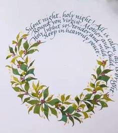 a wreath made out of leaves and berries with words written in the center around it