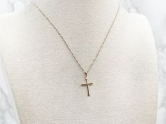 This classic yellow gold pendant is delicate and dainty, perfect for adding a sweet, subtle touch of faith to your look. Whether you choose to accessorize for a special occasion or just to bring a little joy to a regular day, this delightful cross will brighten up any ensemble!This pendant does not come with the chain shown. Don't hesitate to get in touch with us, we will help you find the perfect chain for your style and budget!Metal: 14K Yellow GoldMeasurements: 14 x 26 mm, with bailMarks: "14K USA" Stamped on the reverse Yellow Gold Pendants, Cross Pendant, Gold Pendant, Special Occasion, Yellow Gold, Chain, Pendant, Yellow, Gold