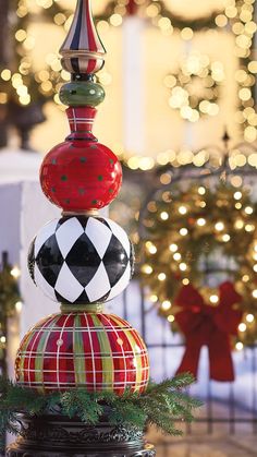 a stack of christmas ornaments sitting on top of a table