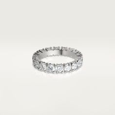 a white gold ring with five diamonds