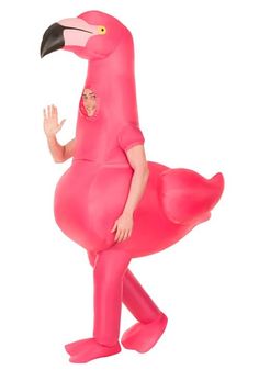 a man in a pink flamingo costume is holding his hand out to the side