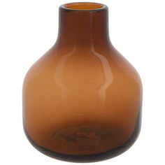 a brown vase sitting on top of a white table