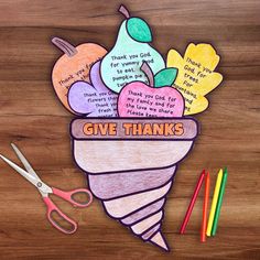 an ice cream sundae with thank you for giving thanks written on it and colored pencils next to it