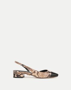 The best-selling Cecile, now in snake-skin embossed leather. Expertly crafted, it features a tapered square toe, a low one-inch block heel for easy support and an elasticized strap for comfort. Pair with jeans and a button-down—this adds instant polish.Snakeskin-Embossed Leather1" heelStore in a cool dry place inside dust bagClean under the supervision of a specialistStyle #I7912L8 Snake Print Heels With Pointed Toe, Luxury Chic Snake Print Heels, Chic Snake Print Heels, Medium Width Leather Snake Print Heels, Designer Shoes Heels, Brown Leather Snake Print Heels, Fall Faves, Tapered Square, Veronica Beard