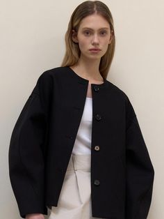 This is a clean and casual jacket by L’oiE that is made out of high quality and sturdy fabric. With unique design detail and trendy mood, you can style it for your refined and casual daily outfit.- Voluminous sleeves detail- Round neckline- Oversized shoulder line Spring Structured Outerwear With Button Cuffs, Modern Oversized Outerwear For Work, Casual Structured Outerwear For Work, Black Outerwear With Button Cuffs For Everyday, Black Everyday Outerwear With Button Cuffs, Everyday Black Outerwear With Button Cuffs, Modern Outerwear With Button Cuffs For Spring, Modern Spring Outerwear With Button Cuffs, Modern Outerwear With Hidden Button Closure For Work