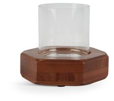 an empty glass sitting on top of a wooden stand with a wood base and lid