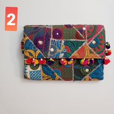 Beautiful clutch bag with vibrant colors , hand embroidery rajaathani culture bag from india  It has one secret pocket inside and zip closure . Its different color variations and style wil go with any dress color and will surely make eyes turn. Width- 17inch  Height 12 inch approximately Festive Handmade Multicolor Pouch, Rectangular Potli Bag With Multicolor Embroidery For Festivals, Rectangular Shoulder Bag With Multicolor Embroidery, Traditional Multicolor Pouch Shoulder Bag, Multicolor Embroidered Rectangular Shoulder Bag, Traditional Rectangular Potli Bag With Multicolor Embroidery, Festive Multicolor Rectangular Shoulder Bag, Bohemian Rectangular Festive Pouch, Bohemian Shoulder Bag With Zari Work For Festivals