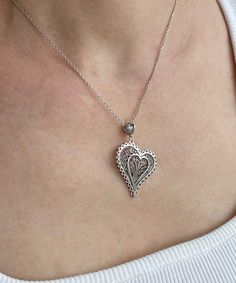 Introducing our Handcrafted Filigree Art Asymmetric Heart Figured Women's Silver Pendant Necklace! This stunning piece features a unique design with an asymmetric heart-shaped pendant, measuring 1.65 inches in height and 1.05 inches in width, suspended from a 20-inch silver chain. Expertly crafted with filigree art, this necklace is a beautiful addition to any jewelry collection. It comes with a silver polish cloth and a luxurious gift box, making it the perfect gift option for Mother's Day, ann Open Heart Jewelry For Valentine's Day Jewelry Making, Unique Heart Charm Pendant Jewelry, Double Heart Beads Necklaces For Jewelry Making, Heart Pendant Necklace As A Gift For Her, Unique Heart Pendant Wedding Jewelry, Heart Locket Necklace As A Gift For Her, Unique Heart Pendant Jewelry For Wedding, Heart Locket Necklace Gift For Her, Unique Handmade Open Heart Jewelry