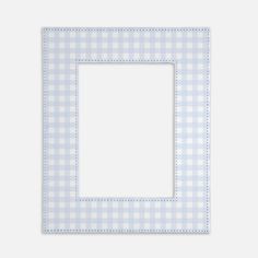 a blue and white checkered paper with a square frame on the bottom, in front of