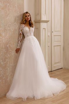 Elegant A-Line Bridal Gown with Lace Detail and Plunging Neckline - WonderlandByLilian V-neck Wedding Dress For Debutante Ball With Fitted Bodice, V-neck Wedding Dress With Fitted Bodice For Debutante Ball, White V-neck Wedding Dress With Lace Bodice, Wedding Dress With Delicate Lace And Fitted Bodice, Elegant V-neck Bridal Gown, Bride's Wedding Dress With Delicate Lace And Fitted Bodice, V-neck Wedding Dress With Sweep Train And Fitted Bodice, V-neck Wedding Dress With Lace Bodice, V-neck Lace Bodice Wedding Dress