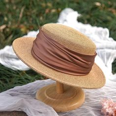 Add a touch of classic charm to your summer wardrobe with these elegant straw boater hats. Crafted from high-quality natural straw, these hats feature a wide brim that provides excellent sun protection while maintaining a stylish look. The hats are adorned with a soft, ruched fabric band in sophisticated colors, including a gentle sage green and a vibrant mustard yellow, allowing you to choose a hue that complements your outfit. Key Features: Made from high-quality natural straw Wide brim for op Straw Boater Hat, Leather Beret, Straw Boater, Knit Beret, Personalized Hats, Hat Beret, Boater Hat, Paris Outfits, Garden Parties