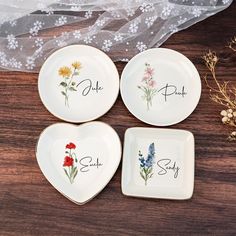 three plates with flowers on them and the words she, she, say written on them