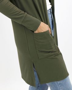 Olive Casual Day Modal Cardigan | Green Spring Cardigan One part comfort, one part wardrobe essential! The best selling Casual Day Modal Cardigan is back this season in an all new neutral olive color to complement your springtime look! Buttery soft, with functional pockets and an open front design, this lightweight cardi layers beautifully over tees, tanks, dresses and more to give you a versatile finishing touch to any look. Why you’ll love it: Silky soft long sleeved modal cardigan with a ligh Green Tops With Side Pockets For Fall, Green Cotton Cardigan For Workwear, Solid Outerwear With Pockets For Loungewear, Everyday Khaki Long Sleeve Outerwear, Casual Open Front Cardigan For Work, Casual Khaki Outerwear For Layering, Spring Everyday Solid Color Outerwear, Green Button-up Cardigan With Pockets, Everyday Solid Button-up Cardigan