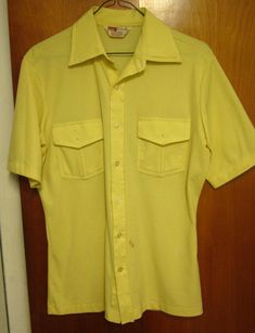 MONTGOMERY WARD vtg small beat-up button-down shirt rockabilly mod pockets hip This is a previously-owned, adult-small (S), yellow, short-sleeved button-down shirt. It measures approximately 19 inches (from underarm seam to underarm seam) and is in fair condition, as there are a few small marks on the front near the very bottom (Montgomery Ward brand, 100% polyester). It will need professionally laundered or dry-cleaned for maximum satisfaction… Montgomery Ward (later known as Wards or Monkey Wa Fitted Shirt With Buttoned Pockets And Spread Collar, Fitted Short Sleeve Tops With Buttoned Pockets, Fitted Shirt With Pockets And Spread Collar, Retro Cotton Collared Camp Shirt, Fitted Cotton Camp Shirt With Button Closure, Fitted Yellow Shirt With Buttons, Yellow Short Sleeve Shirt With Pockets, Vintage Button-up Camp Shirt For Spring, Retro Yellow Cotton Camp Shirt