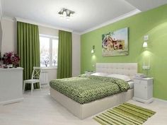 a bedroom with green walls and white furniture