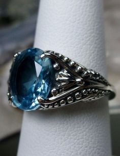 Excited to share the latest addition to my #etsy shop: 3ct Oval Cut Sim Blue Aquamarine Gemstone Sterling Silver Gothic Filigree Ring {Made to Order} #85 https://etsy.me/2LLbnL4 #jewelry #ring #sterling #silver #no #rosegold #yes #girls #blue Exquisite Oval Gemstones With Accents, Formal Cabochon Blue Topaz Jewelry, Oval Fine Jewelry Gemstones For Jewelry Making, Fine Jewelry Oval Topaz Gemstones, Elegant Blue Topaz Cabochon Ring, Oval Topaz Ring With Gemstone Accents, Oval Topaz Gemstones With Prong Setting, Oval Sapphire Ring With Gemstone Accents, Oval Sapphire Gemstones With Accents