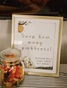 a jar filled with food next to a sign