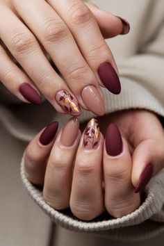 Get ready to embrace the cozy vibes of autumn with these stunning almond-shaped fall nail ideas! Featuring rich burgundies, deep greens, and a sprinkle of gold flakes, these nails perfectly capture the essence of fall. The elegant almond shape enhances the design, providing a modern twist that窶冱 both stylish and seasonal. Elevate your nail game this autumn and let your fingers do the talking! #FallNailIdeas #NailArt #AutumnNails #AlmondNails #NailInspo Fall Nail Ideas, Fall Nail Trends, Fall Gel Nails, Almond Nails Designs, Thanksgiving Nails, Almond Shape, Almond Shaped