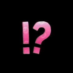 a pink question mark on a black background