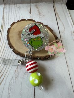 Grinch badge reel on your choice of swivel or belt clip. Toy story The reel is on a retractable badge reel in either alligator clip or belt clip that you choose at checkout.  These are handmade and I take the photos myself. Some glitters are harder to capture the effects they have.  If you do not want beads please add that to the notes. Also some beads may need exchanged out do to availability. That is very rare but could happen.  Thank you for looking at my shop, if you have any questions please ask. I also would like to add, before leaving a less than 5 star review reach out to me first so I can try to fix any issues you may have. Badge Reel Ideas Nurse, Diy Badge Reel How To Make Epoxy, Adjustable Fun Badge Holders For Gifts, Novelty Personalized Adjustable Badge Holders, Novelty Adjustable Badge Holders For Gifts, Novelty Adjustable Badge Holders For Gift, Adjustable Badge Reel With Key Clip As Gift, Adjustable Badge Reel With Key Clip Gift, Teacher Badge Reel