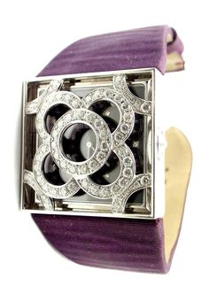 18k White Gold Diamond Danae Lady's Wristwatch by Audemars Piguet. With Diamond-Encrusted Cover, 104 round brilliant cut diamonds. 18k white gold case with a plum satin bracelet. Fixed bezel. Plum dial with diamond-encrusted cover dial with silver-toned hands and diamonds hour markers. Dial Type: Analog. Quartz movement. Scratch resistant sapphire crystal. Pull / push crown. Case diameter: 30 mm. Square case shape. Tang clasp. Functions: hour, minute. Luxury watch style. Watch label: Swiss Made. Audemars Piguet Danae Plum Dial Diamond Satin Ladies Watch 67489BCZZA069MR01. Retail Price: $57,100.00 Details: Measurements: Length: 7" Case: 30mm x 30mm Band: Plum Satin Strap Dial: Plum Dial with Diamonds Movement: Quartz Stamped: Audemars Piguet 750 Swiss Made F40662 *Free Shipping within the U Satin Bracelet, Pink Diamond Jewelry, Analog Watches, Gold Case, Women Wrist Watch, Ladies Watch, Rose Gold Diamonds, Audemars Piguet, Pink Diamond