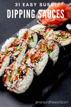 sushi with chopping sauces on a black plate