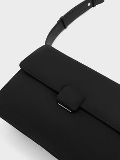 A practical, not-so-little black bag is a universal staple in every wardrobe, and this sleek iteration of the Koa crossbody embodies that. Its minimal, unembellished exterior and inky black finish lets the clean lines stand out for a contemporary take on the classic messenger-style bag. With a push-lock closure that opens up to a roomy interior, it will fit everything you need for the day. Sling it across the body with the thick adjustable strap, or wear it as a casual shoulder bag. Nylon Crossbody Bag, Size Chart For Kids, Charles Keith, Womens Crossbody Bag, Black Bag, Black Cross Body Bag, Belt Size, Belt Bag, Comfortable Shoes