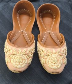 khusssa are brand new, handmade, embroidered, stylish, high quality, beautiful for any occasion, comfortable, and made with 100% pure leather that will give satisfaction to any person that wears it. This shoe has sizes 6-9 in USA women's. Summer Traditional Wear With Gota Work, Festive Closed Toe Ballet Flats, Embroidered Leather Flats With Flat Heel, Leather Embroidered Flats, Bollywood Style Festive Flats With Round Toe, Bollywood Style Round Toe Flats For Festive Occasions, Festive Flats With Dori Work, Festive Ankle-length Flats With Dori Work, Festive Meenakari Round Toe Flats