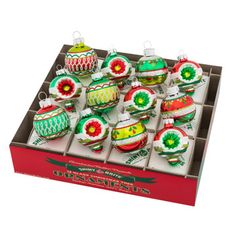 christmas ornaments in a box on a white background