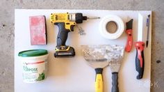 tools are laid out on top of a piece of white paper with glue, scissors and other items