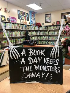 Spooky Book Display Library, Halloween Display Case School, Spooky Library Displays, Haunted Library Trunk Or Treat, Window Display Halloween, Magic Halloween Decor, Book Return Box Ideas, Halloween At The Library, Halloween Decorations For Library