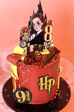 a red and yellow birthday cake with an image of a woman in the top hat