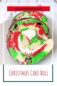 a christmas cake roll on a plate with the words, christmas cake roll written in red and green