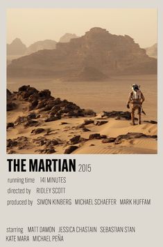 the martian movie poster with an image of a man walking on rocks in the desert