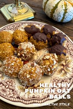 healthy pumpkin balls on a plate with chocolate and sprinkles in the middle