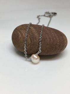 "5mm Peach cream solitaire fresh water pearl hypoallergenic stainless steel sturdy shiny cable chain lobster claw closure necklace. Available in 14\",15\",16\", 18\" Hand made jewelry! All purchase will arrive in gifts boxes Thanks for stopping by! See similar listings https://www.etsy.com/listing/746071892/single-pearl-necklace-solitaire-pearl?ref=shop_home_active_1&frs=1 https://www.etsy.com/listing/746055542/single-pearl-necklace-solitaire-pearl?ref=shop_home_active_3&frs=1" Stainless Steel Pearl Chain Necklace For Gift, Gift Jewelry With Pearl Chain In Stainless Steel, Gift Jewelry With Pearl Chain And Stainless Steel, Stainless Steel Jewelry With Pearl Chain For Gifts, Pearl Necklace With Cable Chain For Gift, One Pearl Necklace, Gifts Boxes, Single Pearl Necklace, Peach Cream