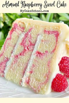 a close up of a slice of cake on a plate with raspberry topping