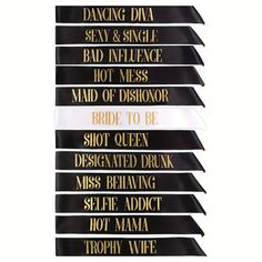 five black and white banners with gold foil lettering on the front, set against a white background