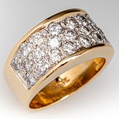 This beautiful wide band diamond ring is accented with twenty-three (23), bead set, round brilliant cut diamonds. The ring measures 9.6mm at the top, rises 4.4mm above the finger, tapering to 6.3mm wide and 1.3mm thick at the base of the soft European shank. It is currently a size 6. Luxury Yellow Gold Domed Wide Band Ring, Luxury Wide Band Diamond-cut Jewelry, Luxury Thick Band Dome Ring For Formal Events, Luxury Wide Band Jewelry With Diamond Accents, Modern Diamond Cocktail Rings, Thick Diamond Ring, Thick Diamond Band, Wide Band Diamond Ring, Wide Diamond Wedding Bands