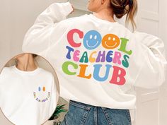 Cool Teacher Club Sweatshirt, Retro Teacher Sweatshirt, Cool Teacher Sweatshirt, Back To School Shirt, Teacher Gifts, Funny Teacher Sweater Welcome to Style Art US! 𝐒𝐈𝐙E  𝗔ND 𝐂𝐎𝐋𝐎𝐑𝐒: For  size and color options,  please see listing images. Gildan Brand, 50% cotton, medium weight and soft. Usually runs true size.  DTF printing method is used for these shirts. 𝗛𝗢𝗪 𝗧𝗢 𝗢𝗥𝗗𝗘𝗥: 𝟏. Please, check and review listing photos. 𝟐. Select Your T-Shirt size and color from drop down menus. 𝟒. Choose Your Quantity you want. 𝟒. Click 𝗔𝗗𝗗 𝗧𝗢 𝗖𝗔𝗥𝗧. Go to your card and finalize your order. CARE INSTRUCTIONS: Turn the shirt inside out. Machine wash cold with mild detergent. Tumble dry very low. Do not use bleach. Do not iron directly on design. RETURNS and CANCELLATION: If the i White School Spirit T-shirt For Winter, Trendy White Pre-shrunk Sweatshirt, Cool Long Sleeve Cotton Tops, Trendy Long Sleeve Tops With Funny Text, White Long Sleeve T-shirt With Funny Text, Relaxed Fit Long Sleeve T-shirt For School, Winter School T-shirt With Letter Print, Cute Long Sleeve College T-shirt, White Long Sleeve Tops With Funny Text