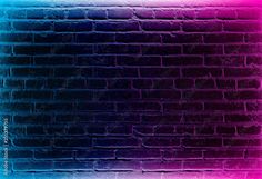 a brick wall that has been painted pink and blue with the colors of the rainbow