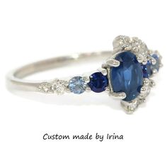 This Enchanting Ring features an oval shape 1.2 carat Blue Sapphire. Flanked by .30 carat 2 shiny deep blue sapphires, .20 carat aqua color 2 sapphires, .40 carat 7 Ice Gray Diamonds. Set in 14k white gold. Can be custom made in rose or yellow or white gold. Please choose the gold color at checkout. OOAK (one-of-a-kind) ring makes you the owner of something that nobody else has. Find your true style! Own this ring! Ethical Sourcing: This ring has a natural, ethically-sourced stones and recycled Oval Blue Tanzanite Sapphire Ring, Blue Oval Sapphire Ring With Prong Setting, Marquise Cut Blue Sapphire Ring, Heirloom Blue Sapphire Diamond Ring, Blue Marquise Sapphire Ring For Promise, Blue Marquise Sapphire Promise Ring, Blue Sapphire Marquise Ring For Promise, Blue Sapphire Marquise Promise Ring, Gift Marquise Cut Sapphire Ring