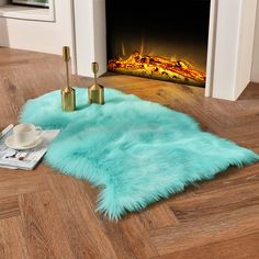 PRICES MAY VARY. √ Soft & Fluffy Sheepskin Rugs - Made from premium faux sheepskin fur with 3" high piles and non-skid suede backing, this turquoise blue area rugs provide a butterfly touch, ultra soft and cozy. √ 2x3 ft Small Area Rugs - this pretty sheepskin rugs is ultra soft, warm, no smell and not shed, perfect as your bedside rug, nursery rugs, chair seat covers and photo background. √ Premium Materials - 1800 GSM faux fur, high density, fluffy and shaggy; non-slip suede backing, safe for Bay Window Cushion, Window Cushion, Faux Sheepskin Rug, Rocking Chair Cushions, Glass Room, Faux Fur Rug, Fur Rug, Fluffy Rug, Soft Carpet