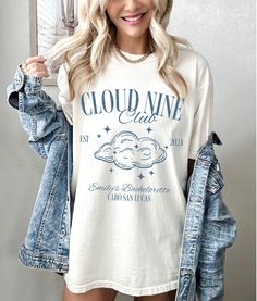 Cloud Nine Bachelorette Shirt * Q U I C K * F A C T S * ✺Comfort Colors tshirt consisting of high quality, 100% ring-spun US cotton for long-lasting comfort ✺The garment is dyed after it's been constructed, giving it a soft color and texture ✺ Machine wash cold and dry on low for best results * S I Z I N G * ✺ Models have sized up for an oversized look | For an oversized look, we recommend sizing up at least 2 sizes ✺ Sizing is unisex so runs like men's, though not overly large ✺ Size guide listed in the listing photos provides exact measurements * S H I P P I N G * T I M E S * ✺ Our items are individually made with love for each of our buyers. Because of this, our processing time is 2-5 business days (depending on order volume) plus transit time, but typically much faster. We know our cus Bride On Cloud Nine Bachelorette, Cloud 9 Bachelorette Party Outfits, On Cloud Bride Bachelorette, In The Clouds Bachelorette, Bachelorette Cloud 9, Big Little Sorority Shirts, Custom Bachelorette Shirts, Scottsdale Bachelorette Party, Fiesta Shirt