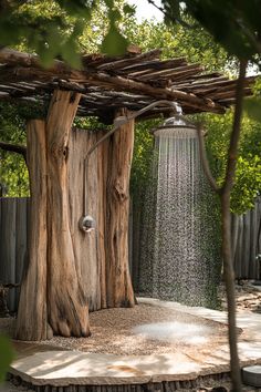 an outdoor shower with water coming from it